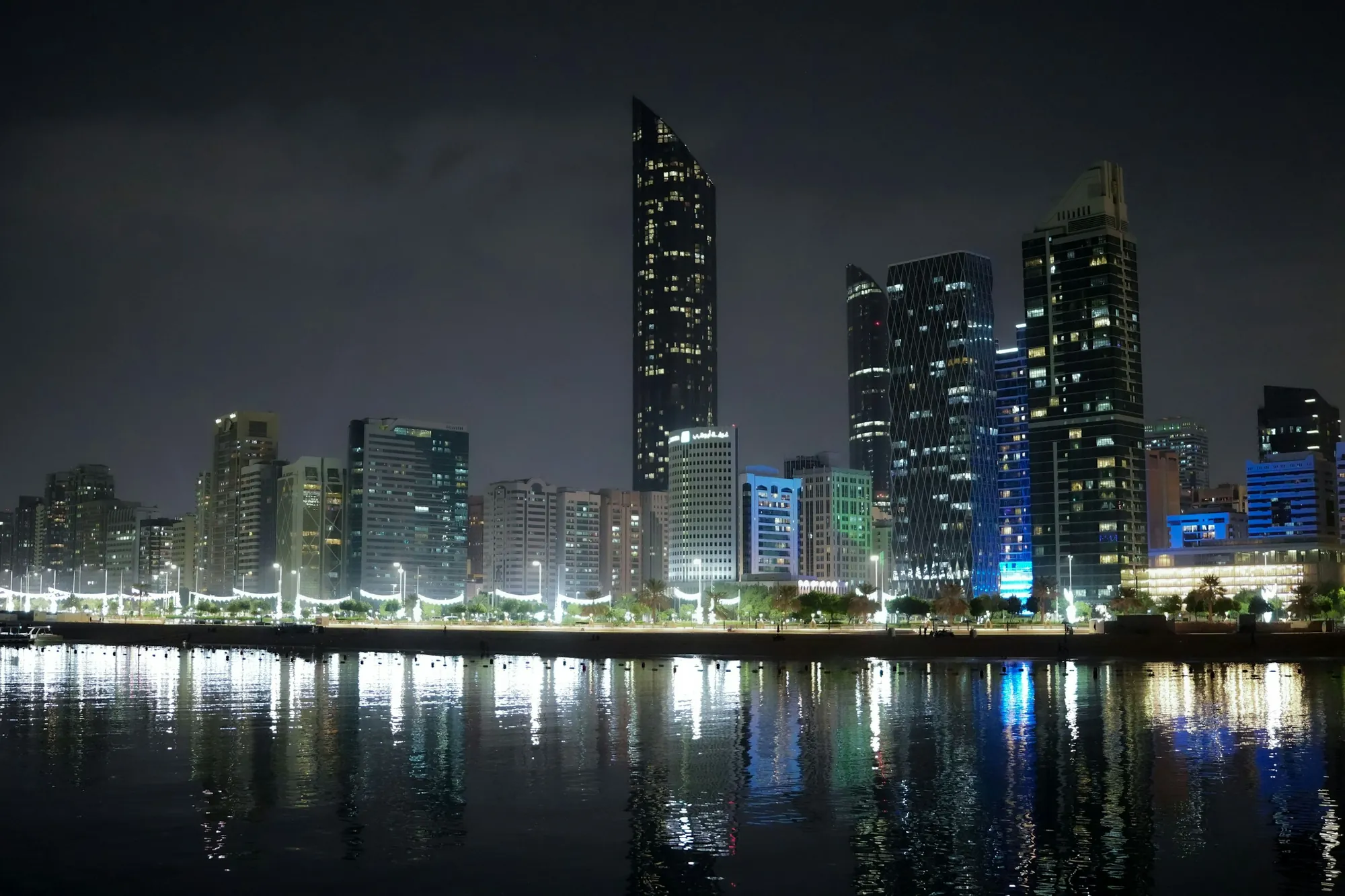 Abu Dhabi towers at night across the water