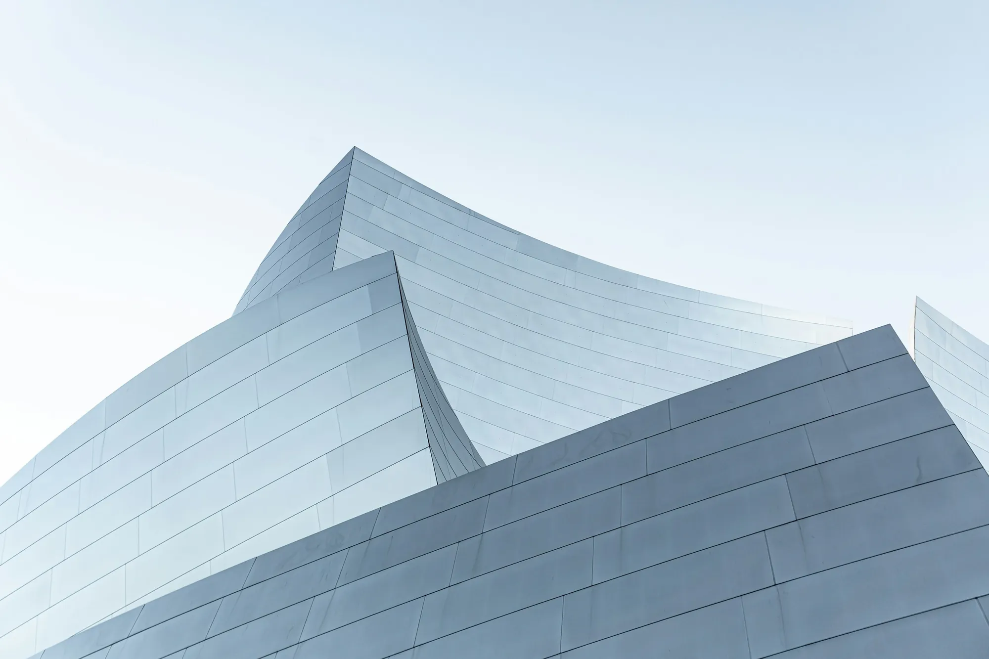A silver building against the sky