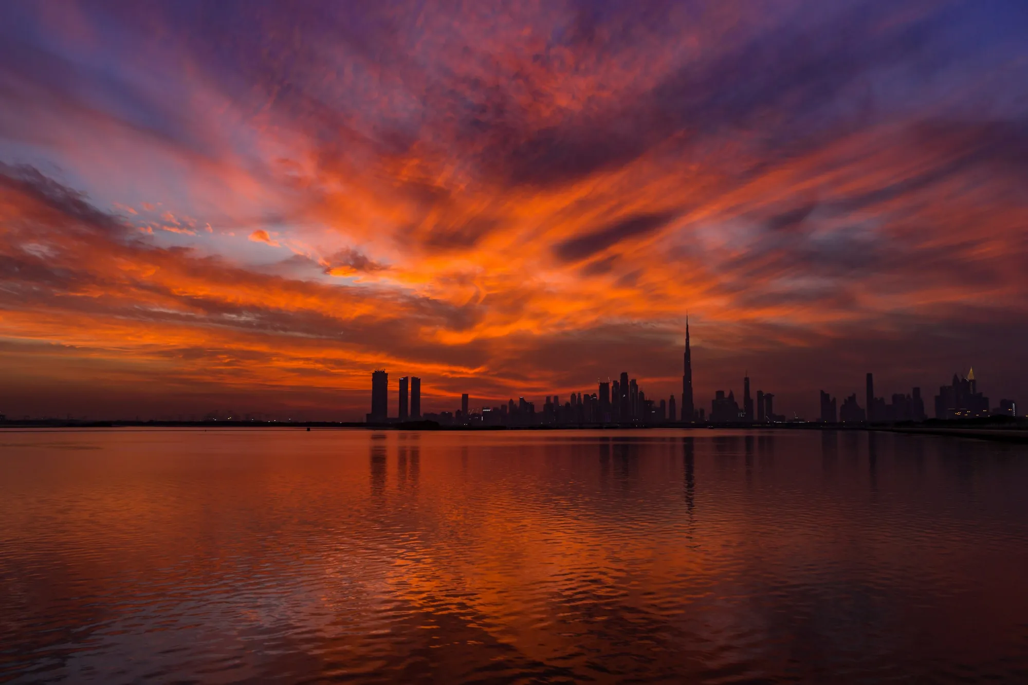 A red sunset over the Dubai skyline